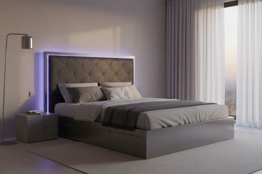 LED smart platform bed with upholstered headboard glowing in soft ambient purple-blue light in a modern bedroom