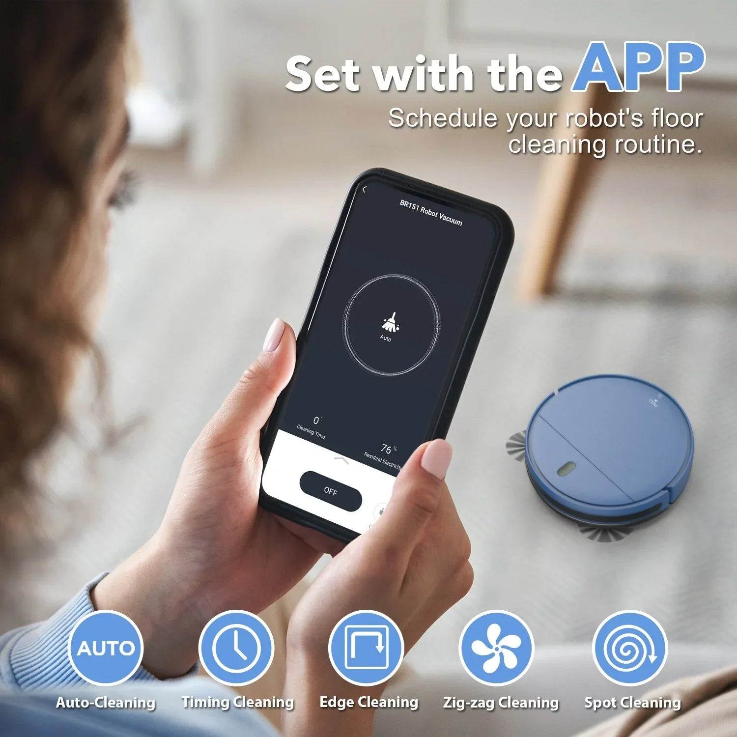 Person using a smartphone app to control a robot vacuum cleaner on a floor.