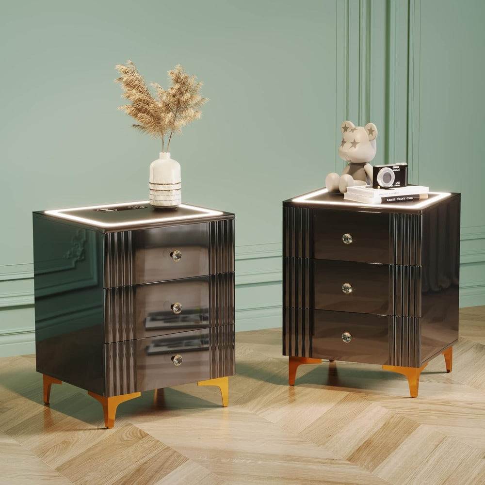 Modern black nightstands with gold legs, LED lighting, and decor, showcased in elegant room