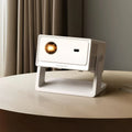 White portable projector on a wooden surface with a blurred curtain background
